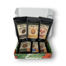 Box of Kauai Gourmet Nuts with various flavor packages on a white background