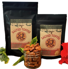 Two packages of Kauai Gourmet Nuts Salted Toffee Almonds and Macadamias with a jar of nuts in the foreground.